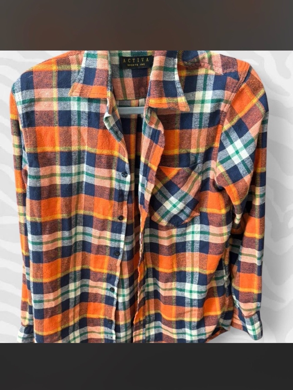 Ativa' flannel shirt in an orange plaid pattern.